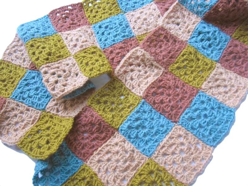 Squares sewn into a scarf.