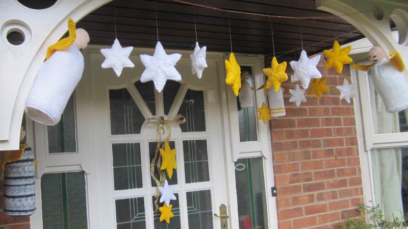 Stars yarn bombing the porch.